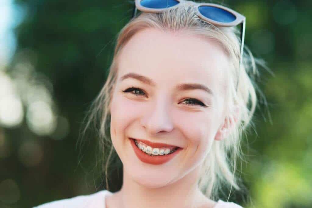 Smiling young woman with braces.